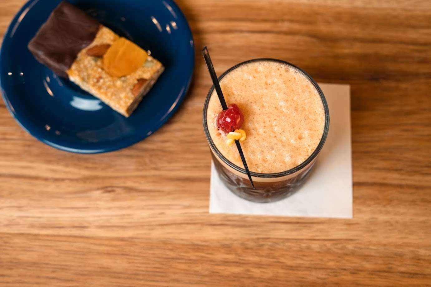 Cold Fashioned cocktail and a dessert dish